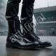Shiny Black Leather Combat Boots on Urban Street